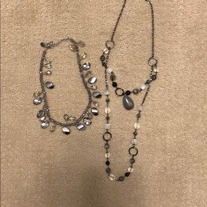 Two gray and black necklaces